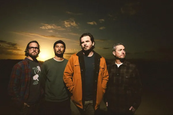 Thrice pose in front of the horizon for their new album Horizons / West.